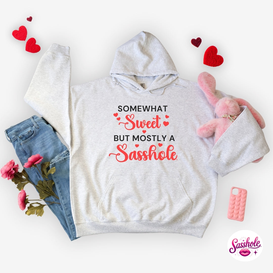 Gray hoodie with humorous text design on a white background with accessories.