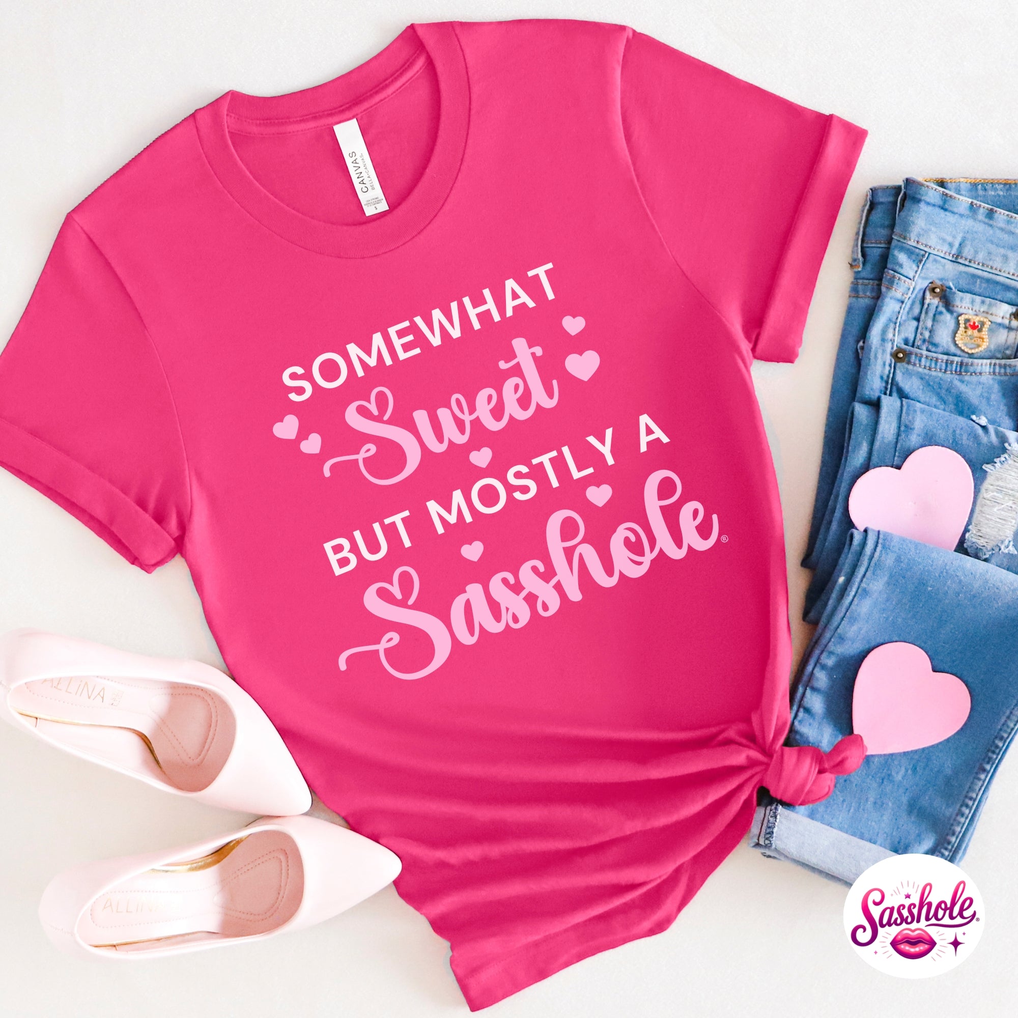 Image of Pink t-shirt with humorous text design on a white background