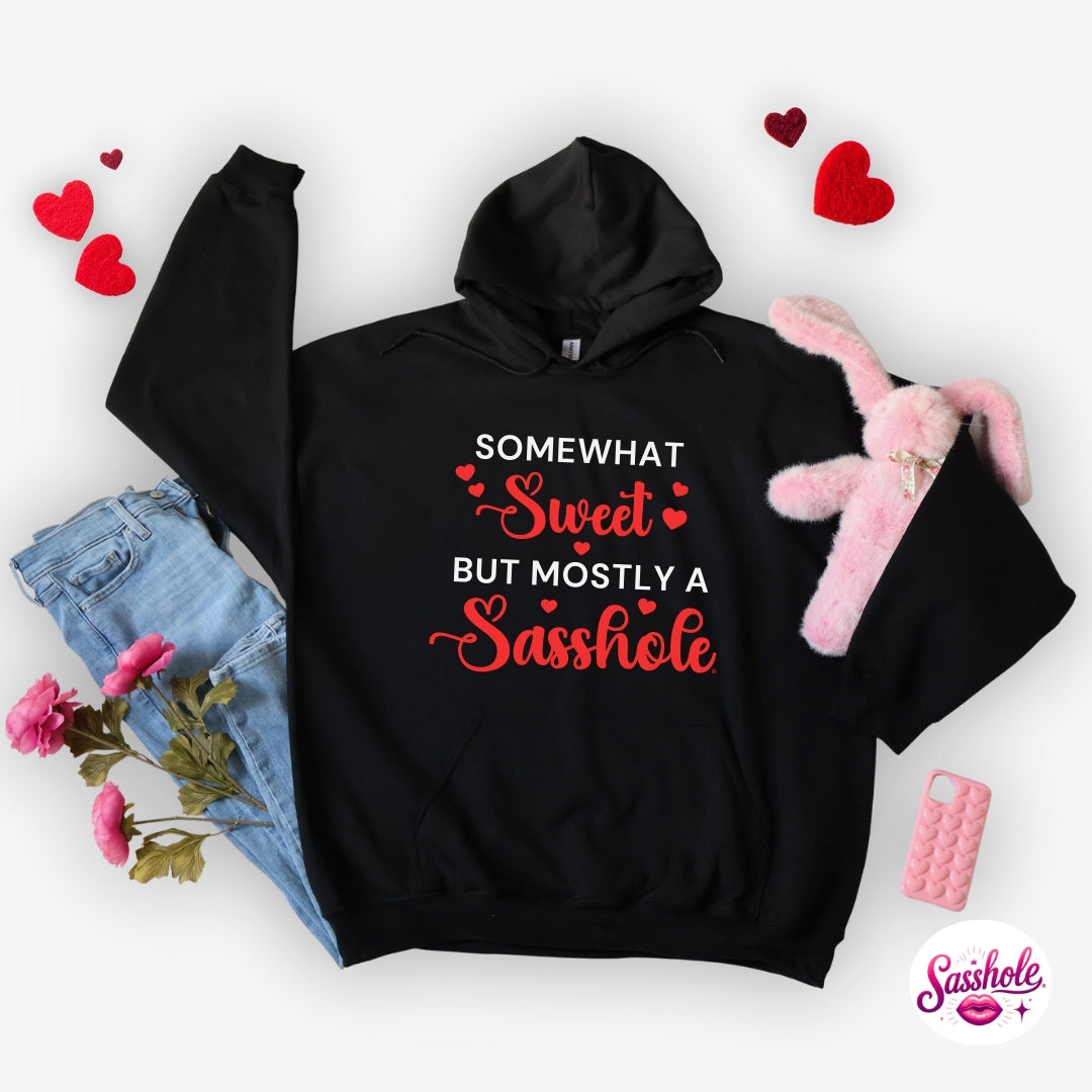 Black hoodie with humorous text design on a white background with accessories.