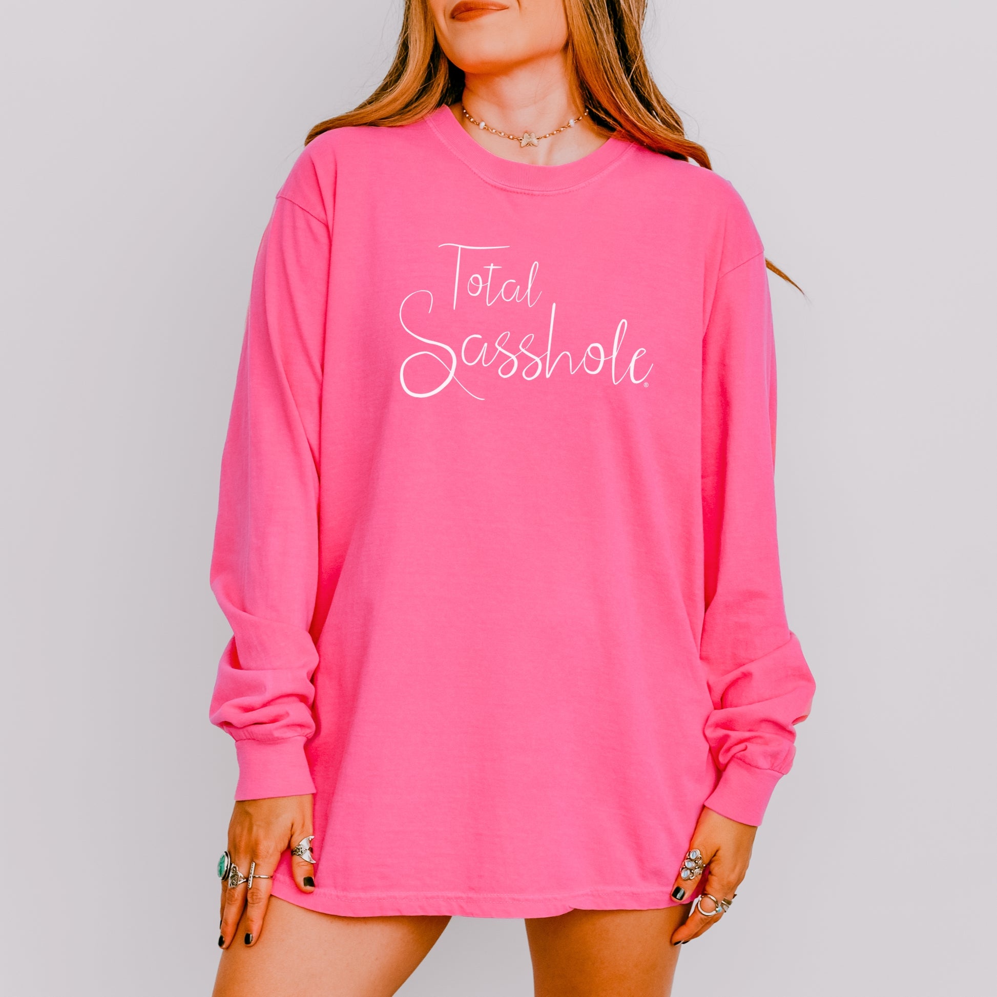 Woman wearing a crunchberry long-sleeve t-shirt with text on a gray background