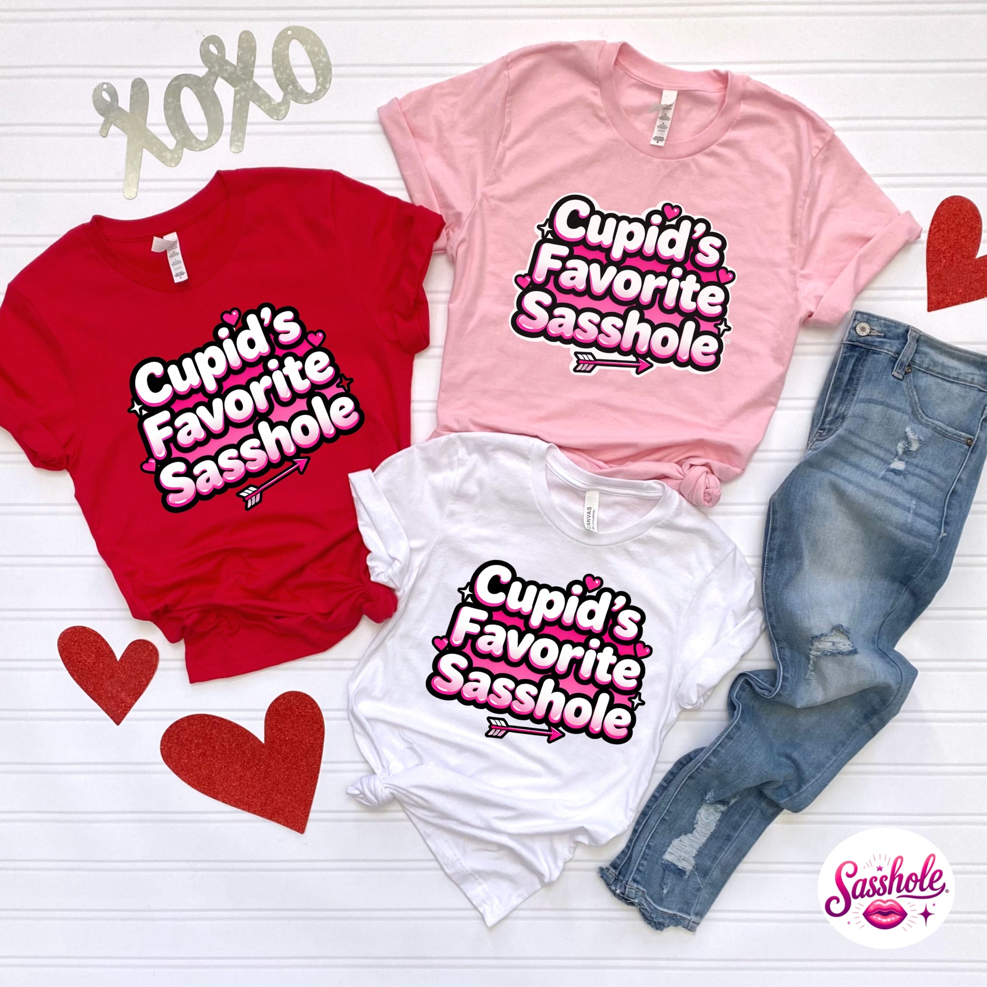 Three shirts with 'Cupid's Favorite Sasshole' text on a white background
