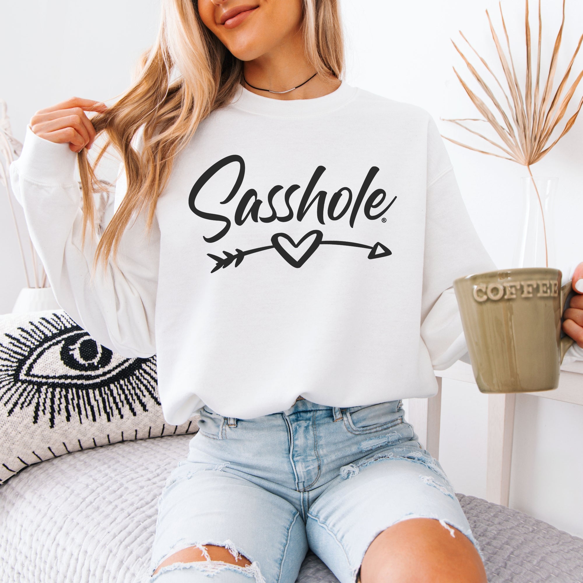 Image of Woman holds a coffee mug while modeling a 