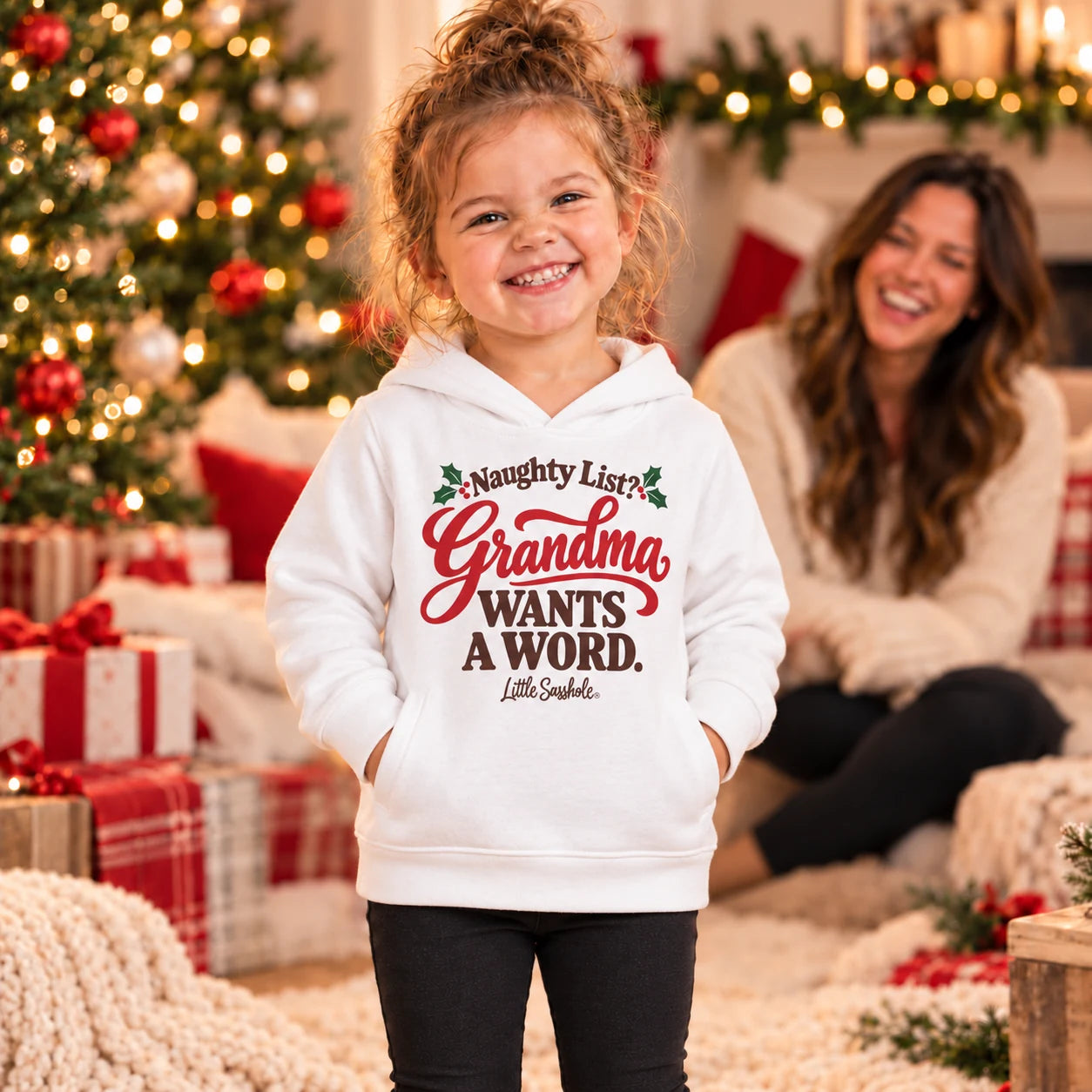 Image of Naughty List? Grandma Wants a Word. — Toddler Hoodie — toddler wearing the White garment at Christmas