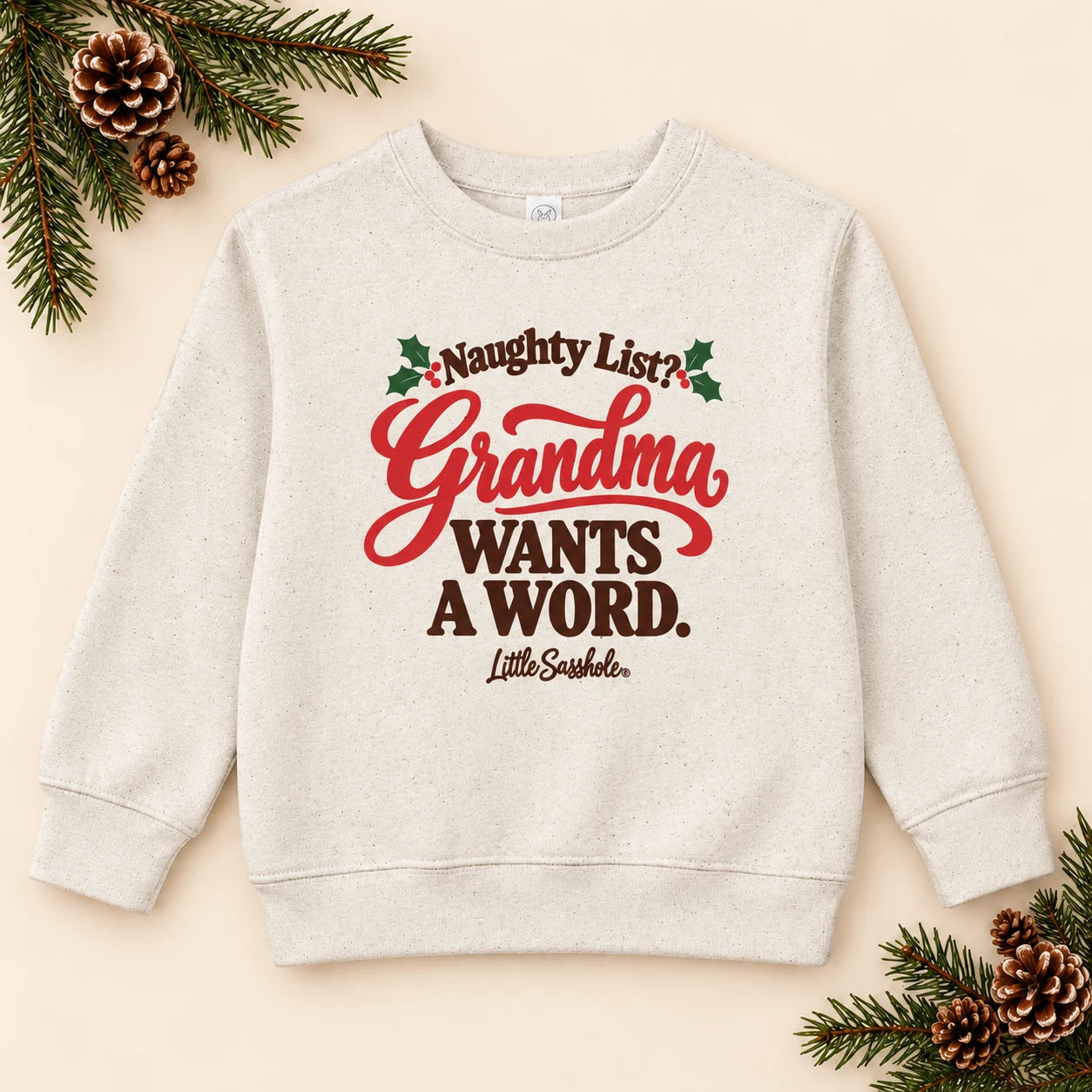 Image of Naughty List? Grandma Wants a Word. — Toddler Sweatshirt — festive product flat lay
