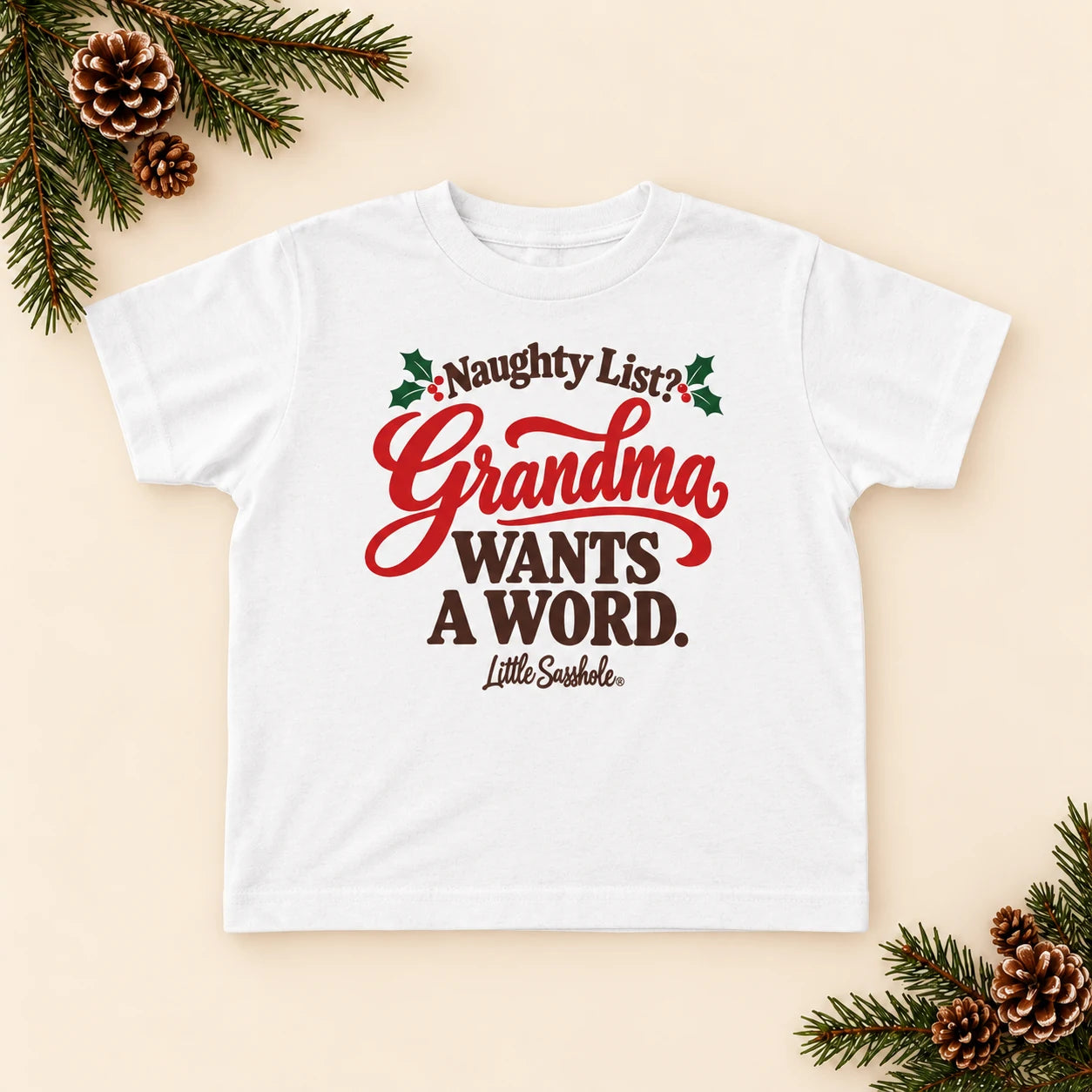 Image of Naughty List? Grandma Wants a Word. — Toddler Graphic Tee — festive product flat lay