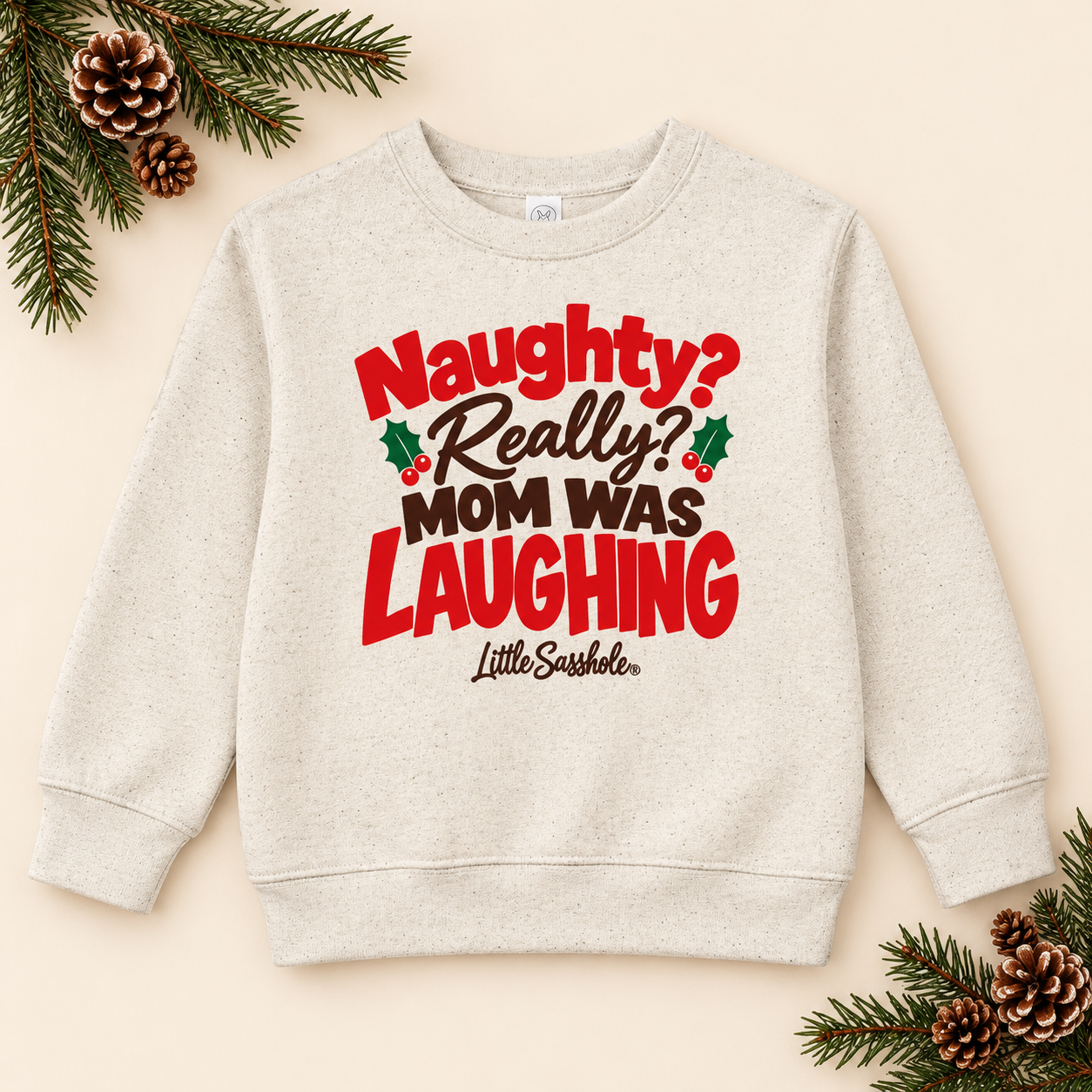 Image of Natural Heather toddler sweatshirt with Naughty? Really? Mom Was Laughing graphic and festive greenery.