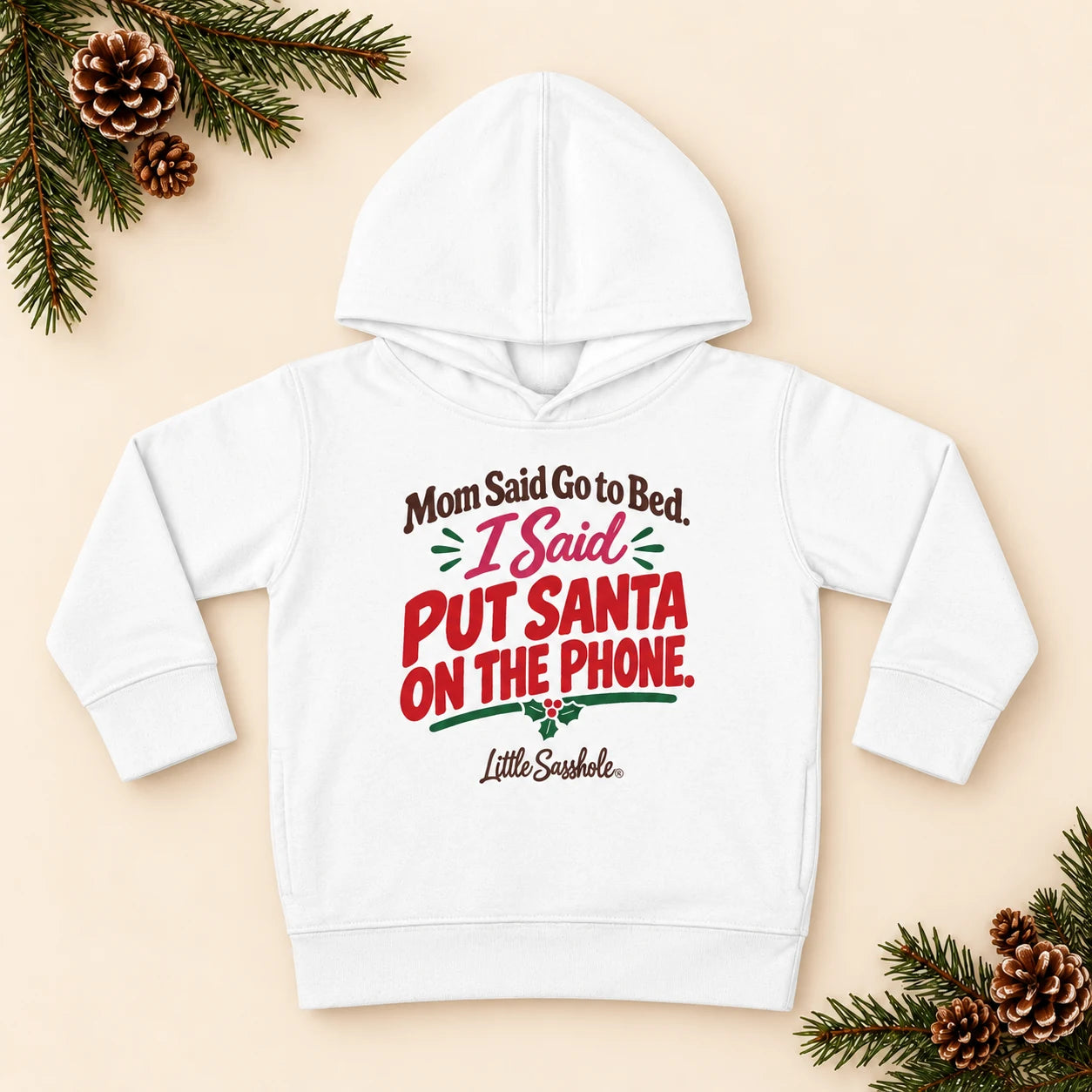 Image of Mom Said Go to Bed. I Said Put Santa on the Phone. — Toddler Hoodie — festive product flat lay