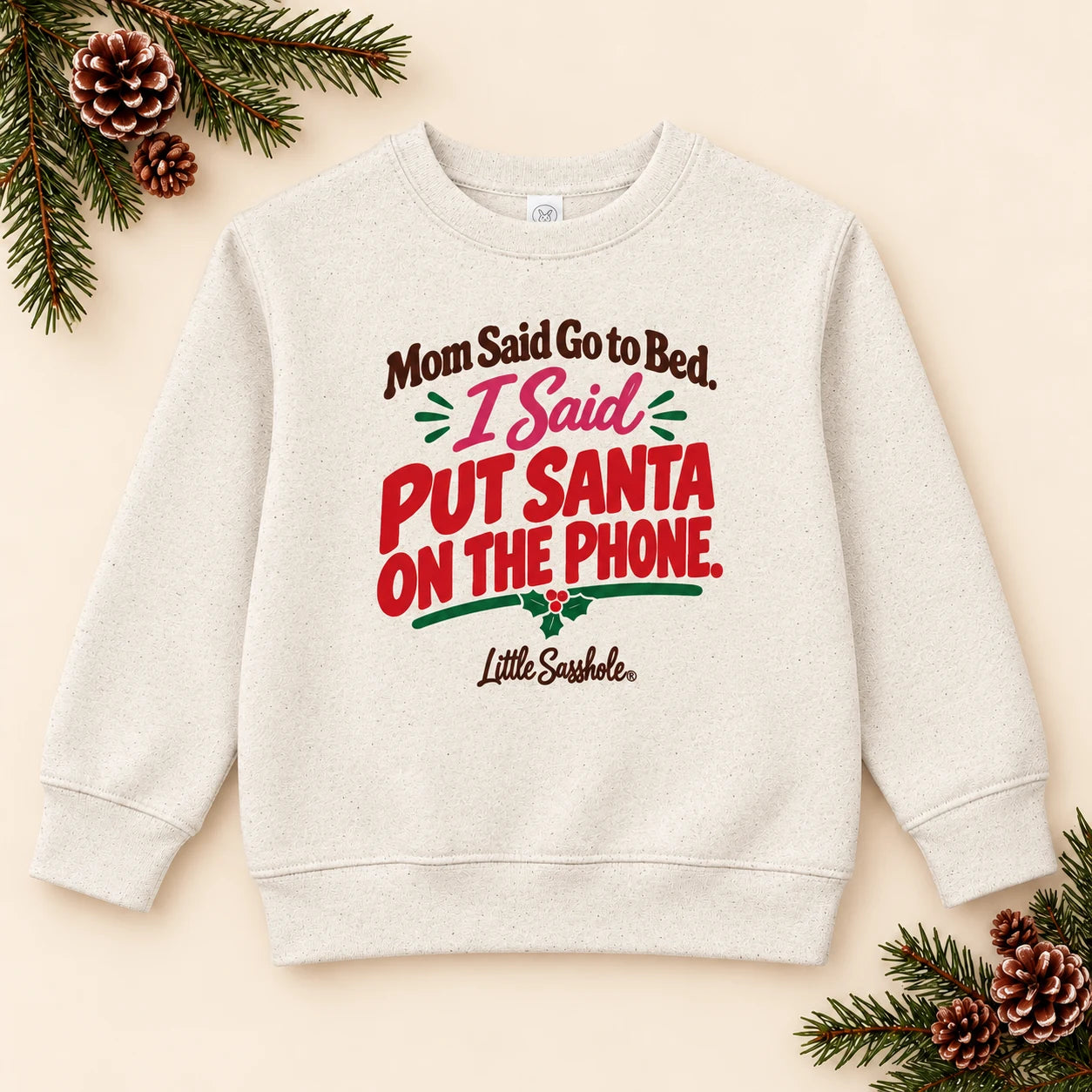 Image of Mom Said Go to Bed. I Said Put Santa on the Phone. — Toddler Sweatshirt — festive product flat lay