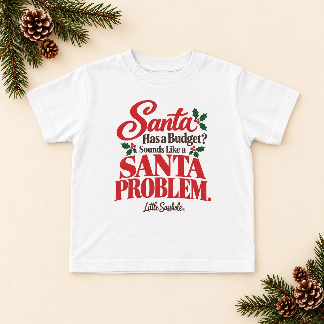 Image of Santa Has a Budget? Sounds Like a Santa Problem. — Toddler Graphic Tee — festive product flat lay