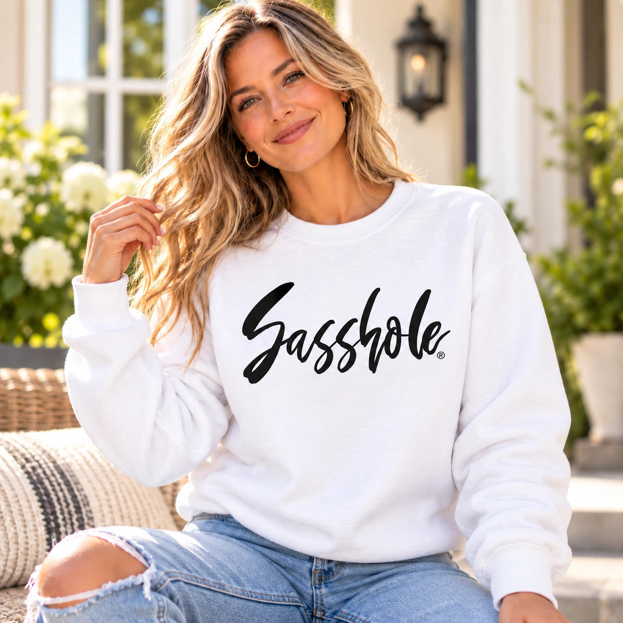 Image of White Signature Script Sasshole fleece sweatshirt on a model in a second lifestyle setting.