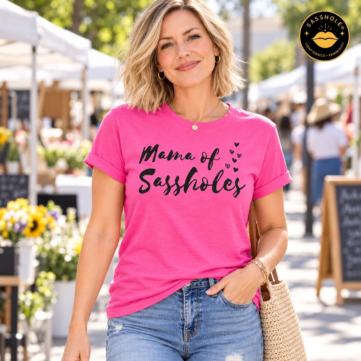 Image of Mama of Sassholes tee in Charity Pink, outdoor lifestyle view.