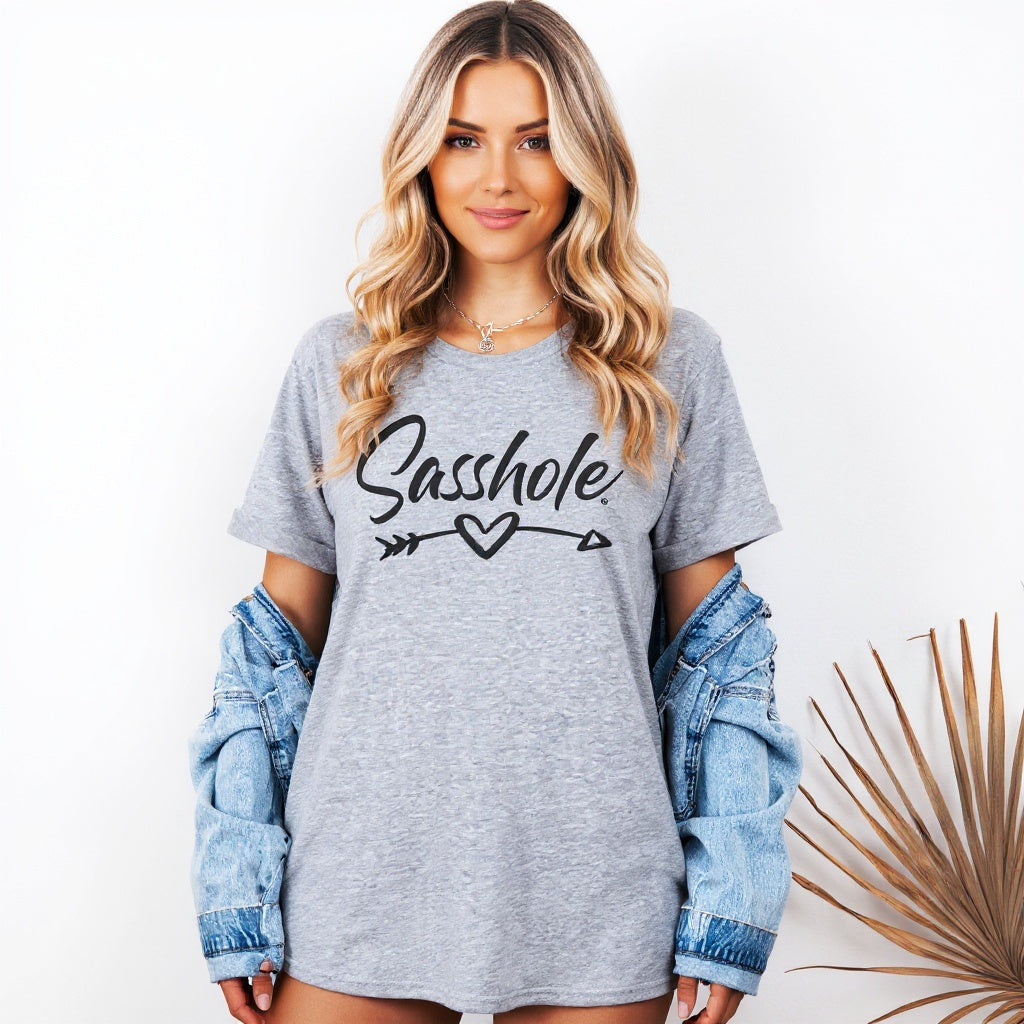Image of Woman wearing a gray t-shirt with 'Sasshole' text, standing against a white background.