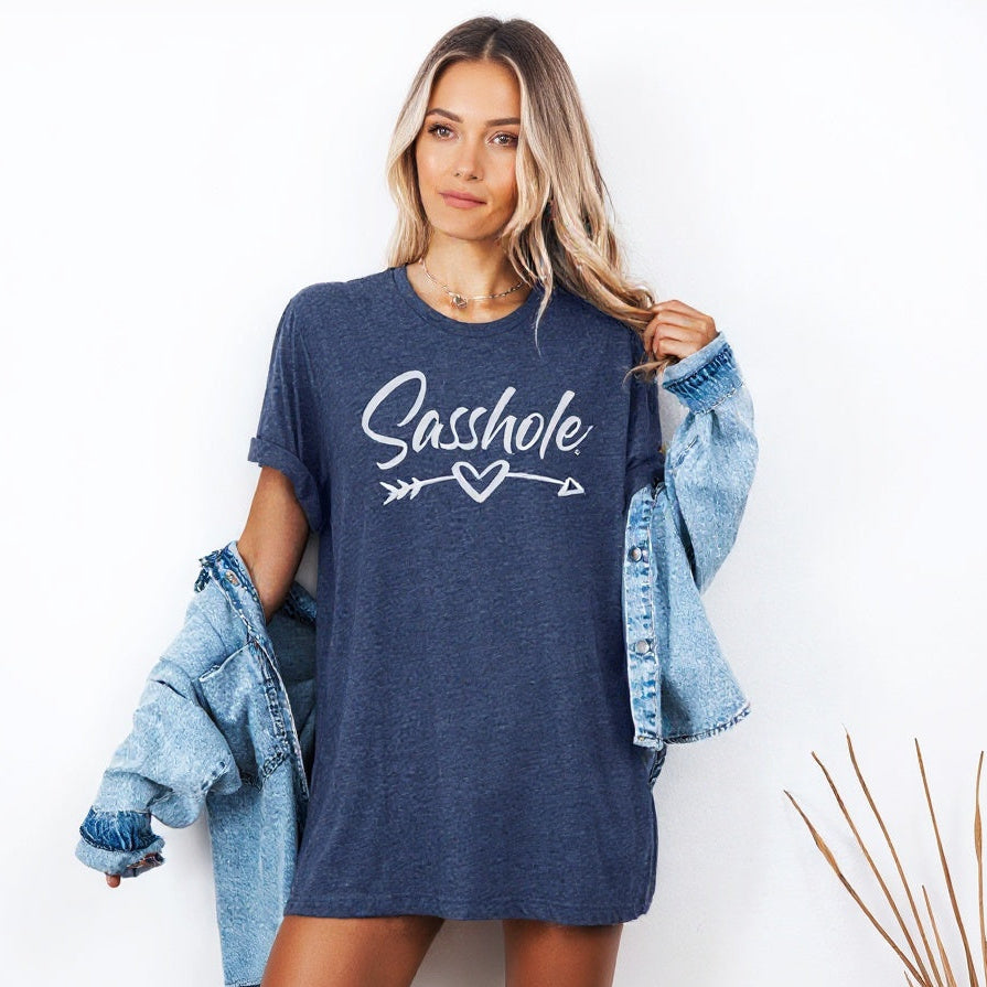 Image of Woman wearing a blue t-shirt with 'Sasshole' graphic design on a white background