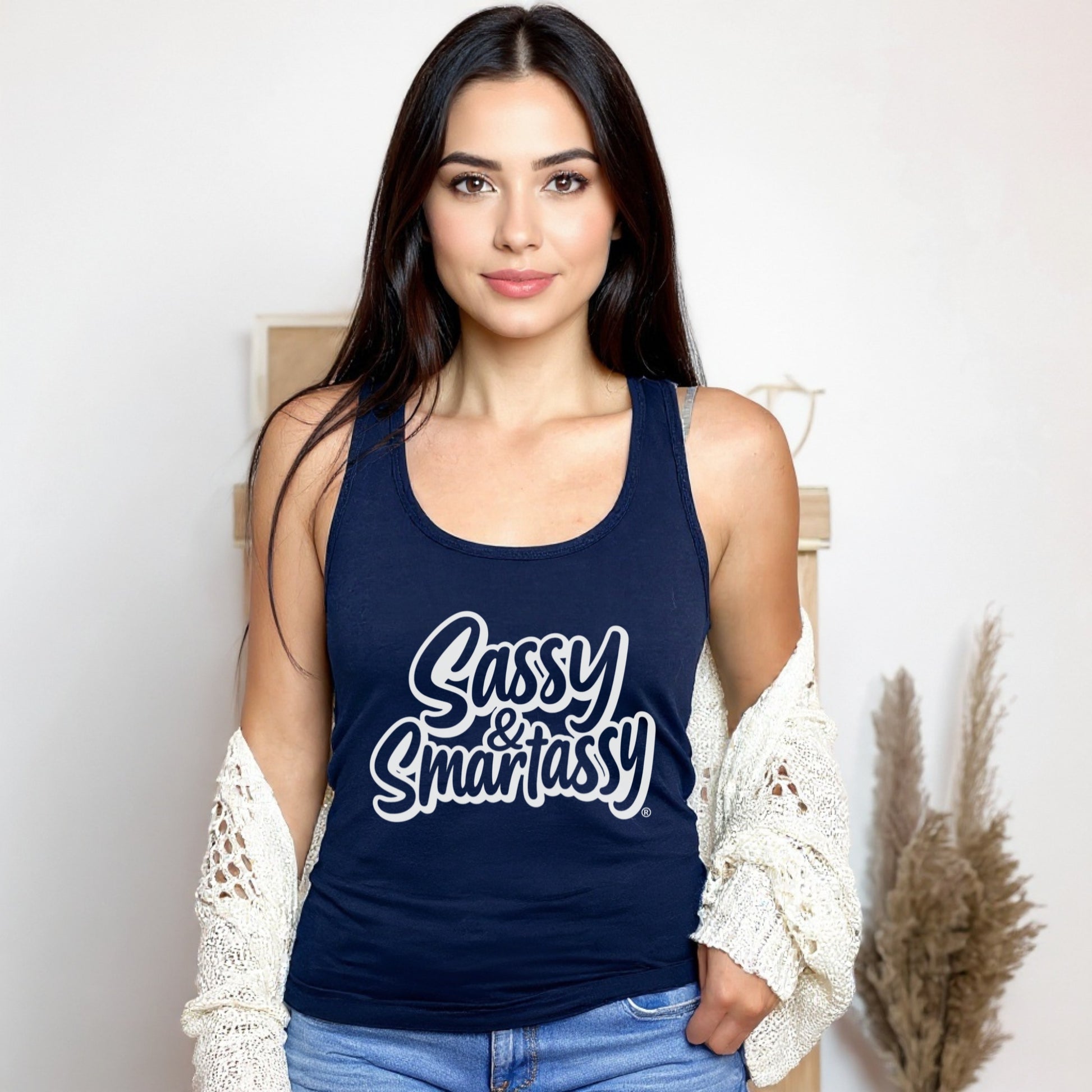 Woman wearing a navy tank top with 'Sassy & Smart Assy' text against a neutral background