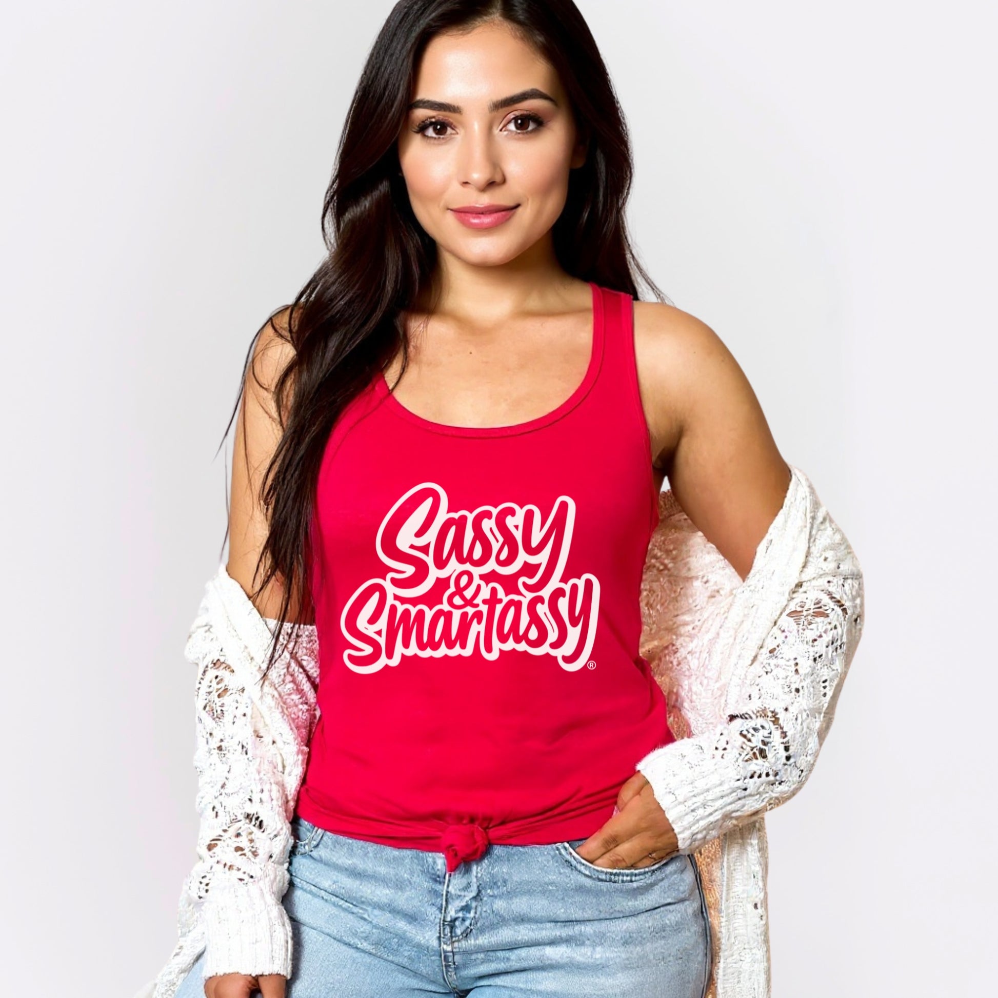 Woman wearing a red tank top with 'Sassy & Smartassy' text on a plain background